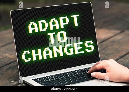 Scrittura visualizzazione testo adatta alle modifiche. Panoramica aziendale abbracciare nuove opportunità crescita progressi nell'adattamento Foto Stock