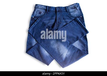 pantaloni jeans blu ripiegato isolato sfondo bianco Foto Stock