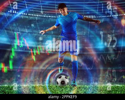 Giocatore di calcio pronto a calciare il calcio durante la partita. scommessa online Foto Stock