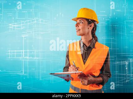 Uomo sicuro architetto con un casco arancione fa uno schizzo Foto Stock