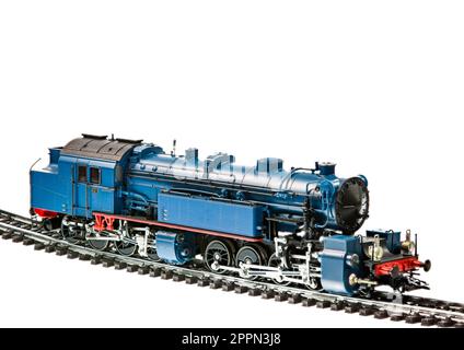 Isolato toy train con un motore a vapore locomotiva Foto Stock