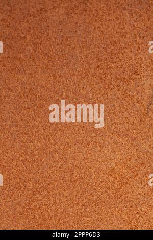 Sfondo beige chiaro opaco di tessuto scamosciato, primo piano Foto Stock