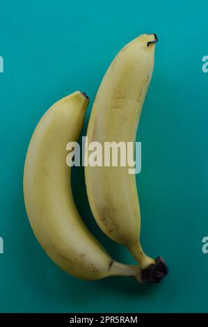 Two ripe bananas set out and ready to eat Stock Photo