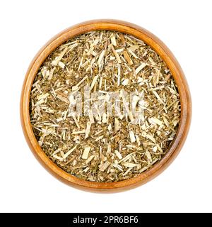 Legno di pino dolce, erbe essiccate, Artemisia annua in una ciotola di legno Foto Stock