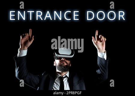 Testo della calligrafia porta d'ingresso. Word Written on Way in Doorway Gate Entry Ingress Passage Portal Man Wear Virtual Reality Simulator Raising Hand during Training. Foto Stock