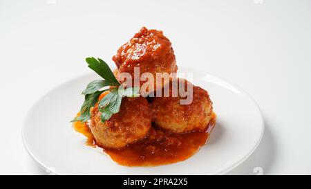 Polpette in salsa di pomodoro dolce e aspre con spezie Foto Stock