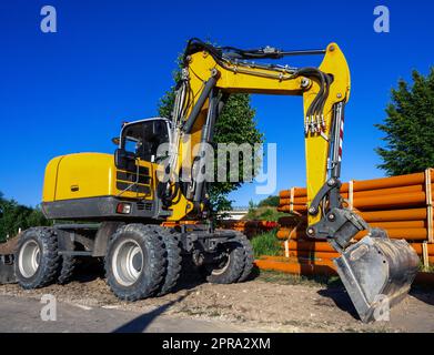 Cantiere con escavatore Foto Stock