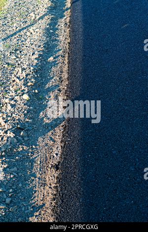 Asfalto nero strada in costruzione in India Foto Stock