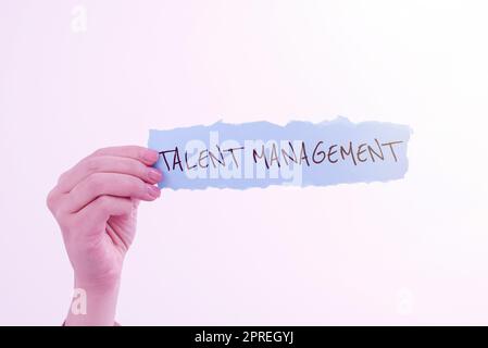 Firma di scrittura a mano Talent ManagementAcquirente assunzione e mantenere dipendenti di talento, Business Concept acquisizione di assunzione e mantenimento di occupazioni di talento Foto Stock