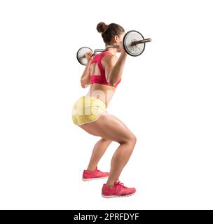 Athletic ragazza lavora presso la palestra con un barbell Foto Stock