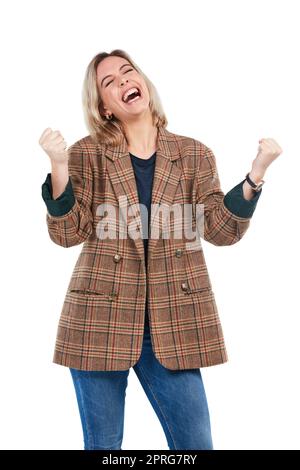 Potete fare qualunque mettete la vostra mente a. Studio shot di una giovane donna che celebra una vittoria su sfondo bianco. Foto Stock