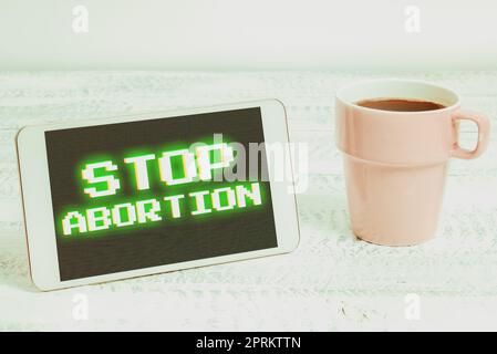 Scrittura visualizzazione testo Stop aborto, Business idea prevenire la crescita incontrollata di cellule anormali nel corpo digitando Online Network protocolli, Cr Foto Stock