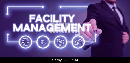Scrittura che visualizza il testo Facility Management, Business idea comprendere le aree monetarie come la finanza e investire l'uomo con una penna che punta sul digitale Foto Stock