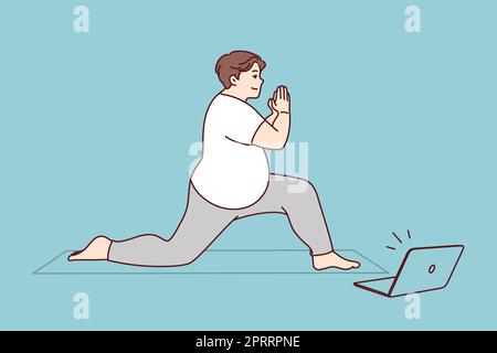 Uomo grasso in allenamento sportswear su tappetino con video lezione on-line sul computer. I maschi in sovrappeso fanno l'esercizio sportivo con lezioni su internet sul computer portatile. Ehea Foto Stock