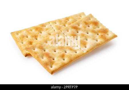 Cracker posti uno sopra l'altro su uno sfondo bianco. Foto Stock
