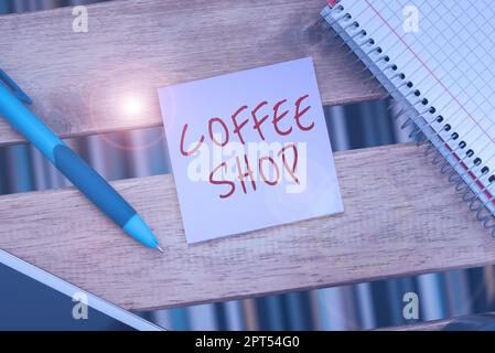 Scrittura che mostra testo Coffee Shop, concetto che significa un ristorante che serve principalmente caffè e pasti leggeri Foto Stock