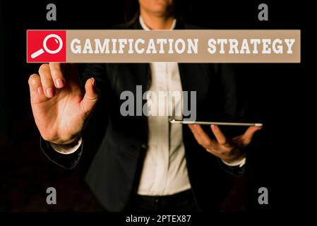 Scrittura visualizzazione di testo Gamification Strategy, Word scritto su Usa ricompense per la motivazione integrare la meccanica del gioco Foto Stock