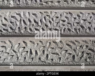 parete in gesso grigio ashlar utile come sfondo Foto Stock