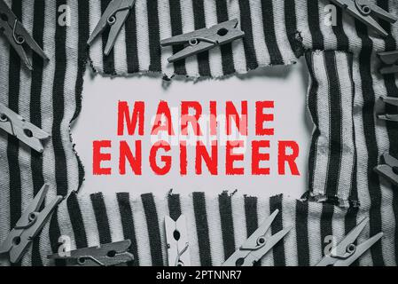 Cartello che mostra Marine Engineer, Word per incaricare la manutenzione e il funzionamento di una nave s è motori Foto Stock