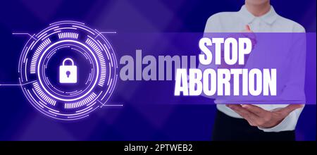 Scrittura testo visualizzato Stop aborto, Parola per sostenere contro la pratica dell'aborto movimento ProLife Foto Stock