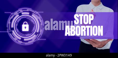 Scrittura testo visualizzato Stop aborto, Parola per sostenere contro la pratica dell'aborto movimento ProLife Foto Stock
