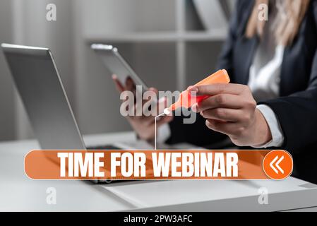 Scrittura manuale del testo tempo per il webinar, seminario di significato concettuale condotto su Internet conferenze Web Foto Stock