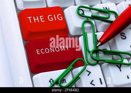 Testo a mano The Gig Economy, foto concettuale mercato dei contratti a breve termine lavoro libero professionista temporaneo Foto Stock