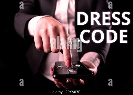Didascalia di testo che presenta Dress Code, parola per un modo accettato di vestirsi per una particolare occasione o gruppo Foto Stock