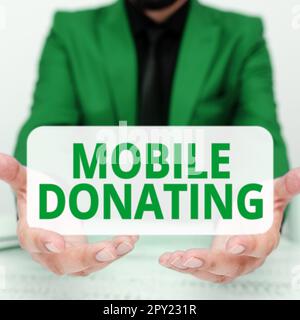 Scrittura a mano di testo Mobile Donating, Word scritto per dare qualcosa a una carità o qualsiasi causa utilizzando dispositivi personali Foto Stock