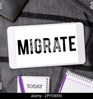 Scrittura manuale del testo Migrate. Panoramica aziendale per spostarsi o viaggiare da una località o località all'altra Foto Stock