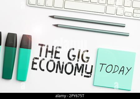 Scrittura a mano del testo The Gig Economy. Foto concettuale mercato dei contratti a breve termine lavoro indipendente temporaneo Foto Stock