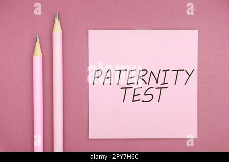 Testo che mostra il test di paternità dell'ispirazione. Business vetrina un test di DNA per determinare se un dato uomo è il padre biologico Foto Stock
