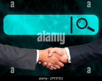 Due uomini in tuta che stringono la mano davanti a uno sfondo futuristico con bagliore colorato. Nuove tecnologie digitali del futuro. La stretta di mano rappresenta un accordo. Foto Stock