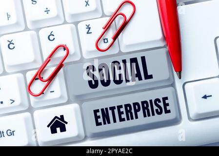 Scrittura a mano di testo Social Enterprise. Parola scritta sul commercio che fa i soldi in un senso socialmente responsabile Foto Stock