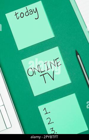 Testo che mostra ispirazione Online TV. Foto concettuale una produzione televisiva trasmessa in tempo reale quando gli eventi accadono Foto Stock