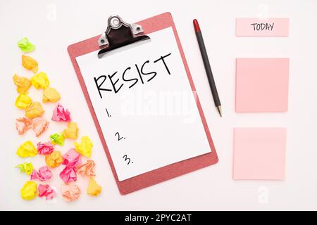 Scrittura visualizzazione testo resist. Parola scritta per combattere contro qualcosa o qualcuno che ti sta attaccando Foto Stock