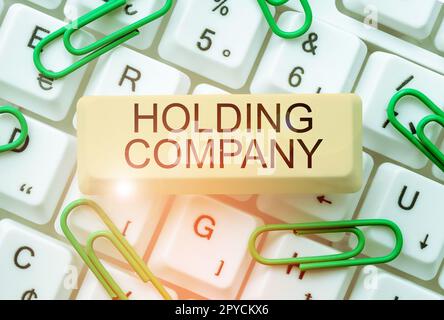 Mostra il cartello Holding Company. Vetrina di business stock proprietà e altri beni finanziari in possesso di qualcuno Foto Stock