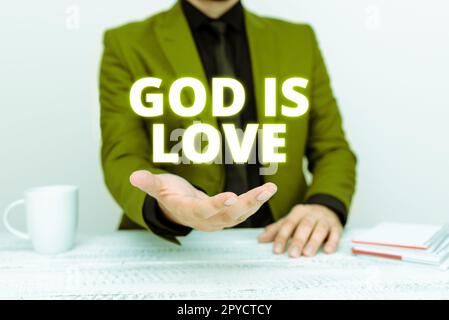 Scrittura del testo Dio è amore. Concetto di Internet credere in Gesù avere fede pensieri religiosi Cristianesimo Foto Stock