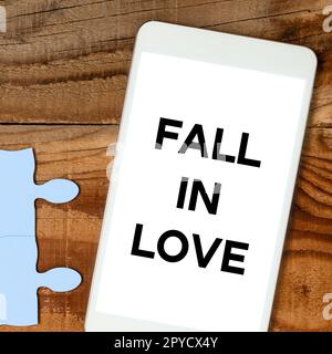 Scrittura che mostra il testo Fall in Love. Vetrina di affari affascinato o affascinato con qualcuno Foto Stock