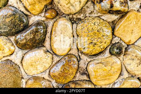 Texture dettaglio di parete di piccole pietre Puerto Escondido Messico. Foto Stock