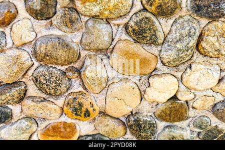 Texture dettaglio di parete di piccole pietre Puerto Escondido Messico. Foto Stock