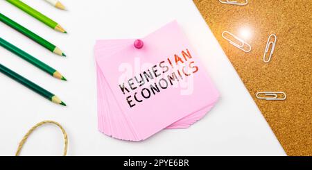 Ispirazione che mostra il segno Keynesian Economics. Business Concept programmi monetari e fiscali da parte del governo per aumentare l'occupazione Foto Stock