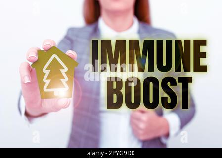 Scrittura a mano testo immune Boost. Vetrina di business essere in grado di resistere a una particolare malattia che impedisce lo sviluppo di agenti patogeni Foto Stock