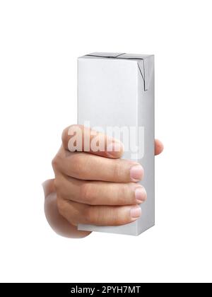 scatola di latte o succo in mano isolata su fondo bianco Foto Stock