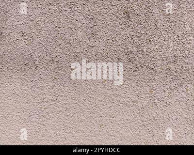 Parete in cemento rosa ruvida irregolare. Sfondo o trama Foto Stock