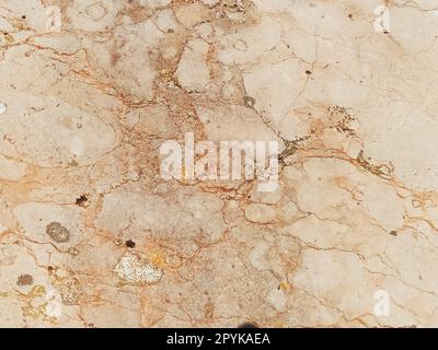 Fondo di marmo, roccia bianca. Marmo con crepe. Colori naturali beige, giallo e marrone. Contesto Foto Stock