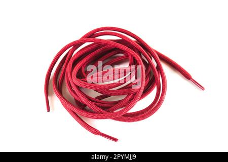 Red lacci delle scarpe contro uno sfondo bianco Foto Stock