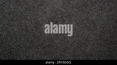 Bella foto in carta vetrata nera con texture e sfondo. Foto Stock