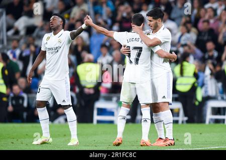 Madrid, Spagna. 13th maggio, 2023. Marco Asensio (R) del Real Madrid celebra il suo gol con i compagni di squadra Lucas Vazquez (C) e Vinicius Jr. Durante la partita di calcio spagnola la Liga a Madrid, in Spagna, il 13 maggio 2023. Credit: Gustavo Valiente/Xinhua/Alamy Live News Foto Stock