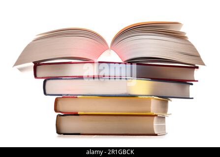 Composizione con pila di libri isolato su bianco Foto Stock